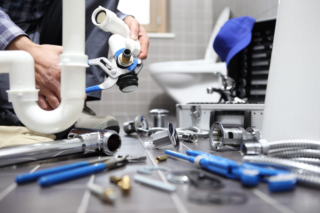 Plumber fixing a pipe